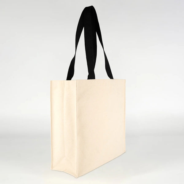 Heavyweight 320 gsm natural canvas tote bag held to show full size
