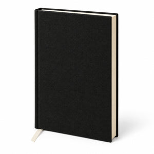 Blank black canvas notebook standing at a three-quarter angle, ribbon bookmark and cream page edges | Pamusan.com