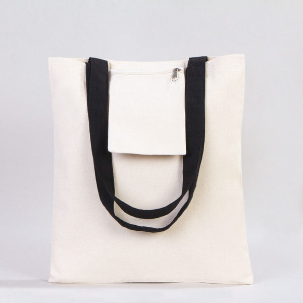 White tote bag with black handles on a light gray background